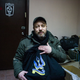 Leonid Krasnopolsky shows off one of his t-shirt designs, which reads “Glory to the heroes!”
